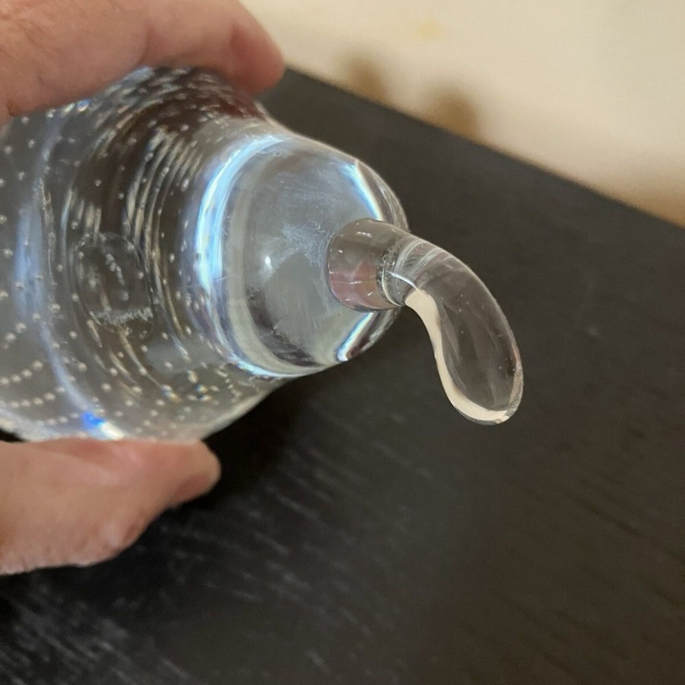 Clear glass pear with controlled bubbles (bullicante) paperweight